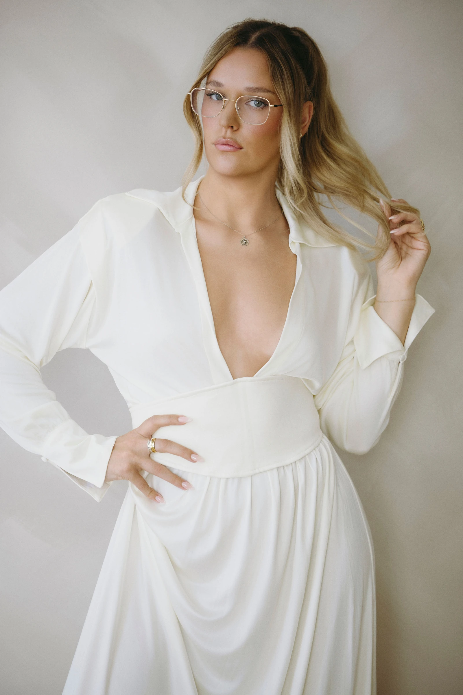 Taylor Thompson in a white dress